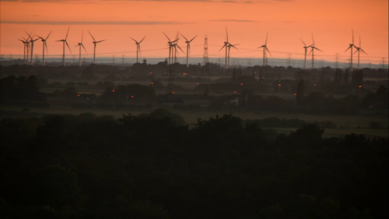 Wind turbines on the horizon at sunset